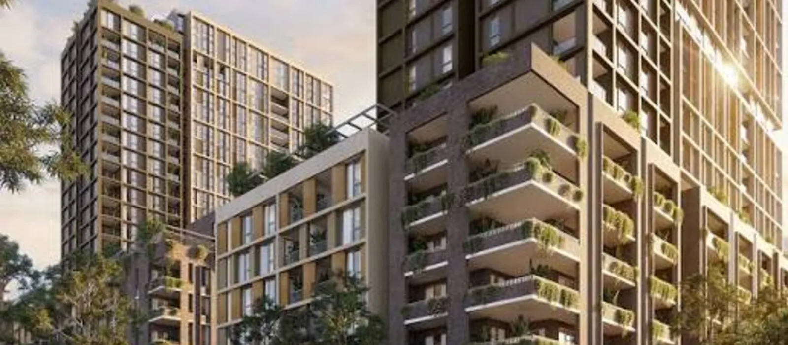 Prestige Sadahalli high-rise towers with balcony greenery close-up